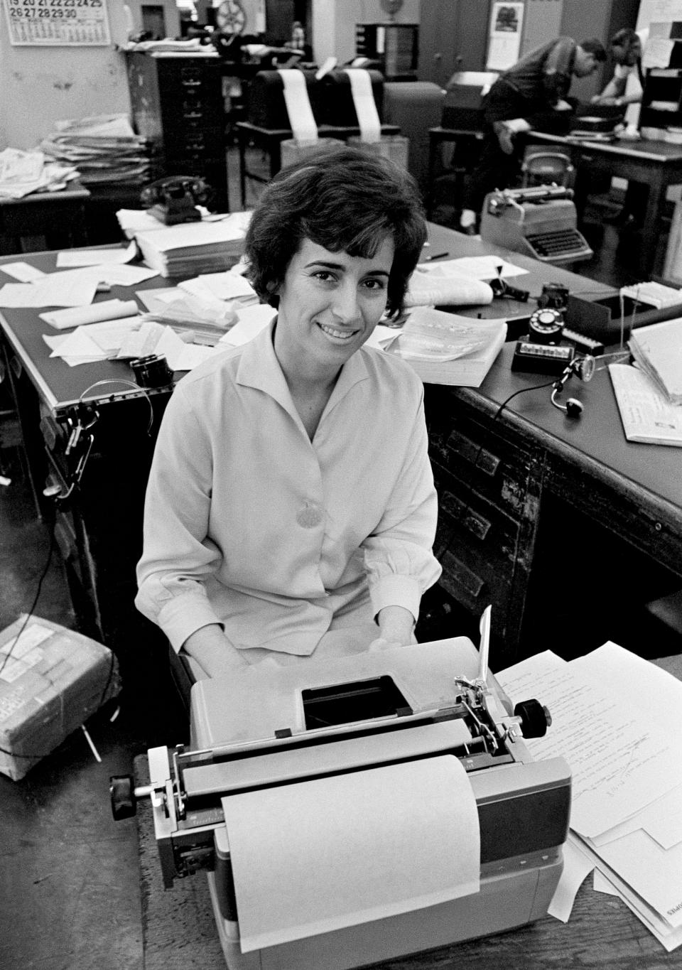 FILE- In this May 1964 file photo, Associated Press journalist, Kathryn Johnson sits at her desk in Atlanta. Johnson, a trailblazing reporter for The Associated Press, died Wednesday, Oct. 23, 2019, at the age of 93, in Atlanta. Her intrepid coverage of the civil rights movement and other major stories led to a string of legendary scoops. Johnson was the only journalist allowed inside Martin Luther King Jr.'s home the day he was assassinated. (AP Photo, File)