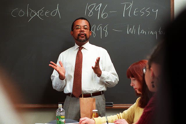 <p>John Blanding/The Boston Globe via Getty</p> Henry Louis Gates, Jr. teaching class at Harvard University's Center of African American Studies in March 1996