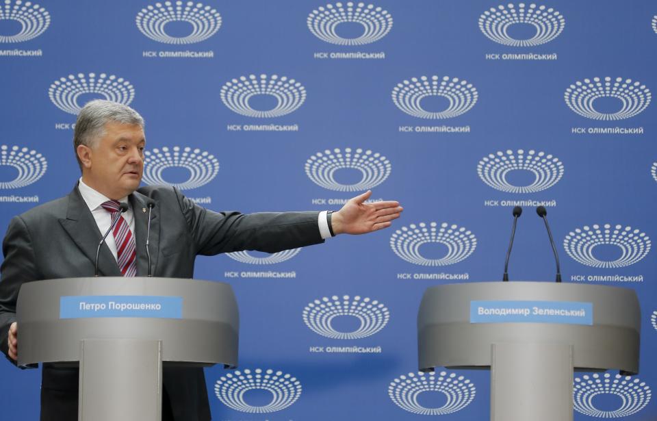 Ukrainian President Petro Poroshenko gestures as he answers to a journalist's question ahead of the presidential elections on April 21, at the Olympic stadium in Kiev, Ukraine, Sunday, April 14, 2019. The event Sunday was the latest unusual scene in the fight between Poroshenko and Zelenskiy, the comedian whom polls show holding a commanding lead. (AP Photo/Efrem Lukatsky)