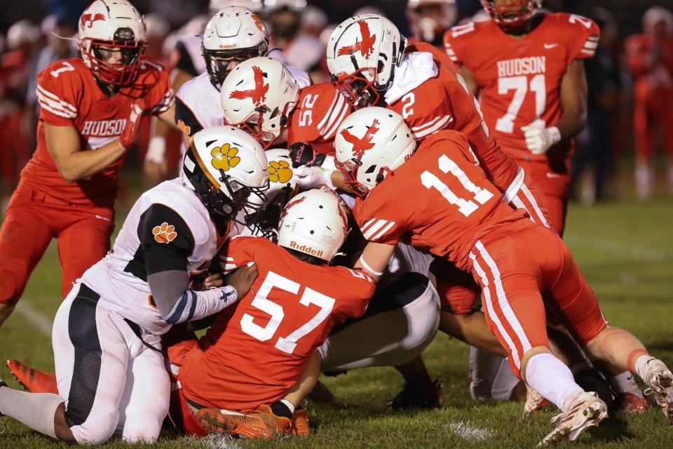 The Hudson defense stops  Maynard/AMSA during the football game at Hudson High School on Sep. 30, 2022.