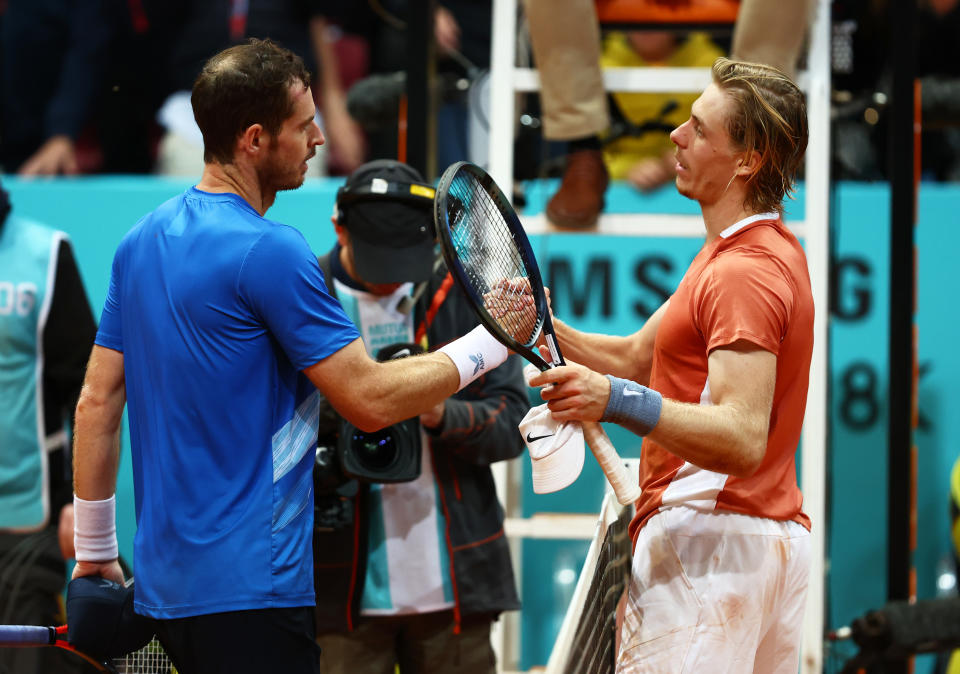 Andy Murray (pictured) shakes hands at the net with Denis Shapovalov (pictured right).