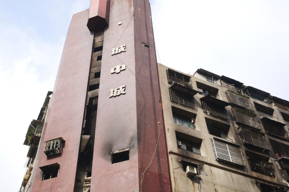 A burnt building is pictured in Kaohsiung in southern Taiwan on Friday, Oct. 15, 2021. Dozens were killed and dozens more injured after a fire broke out early Thursday in a decades-old mixed commercial and residential building in the Taiwanese port city of Kaohsiung, officials said. (AP Photo/Huizhong Wu)