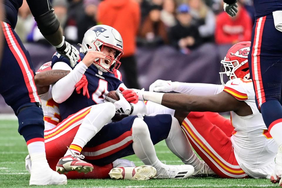 Patriots quarterback Bailey Zappe (4) is sacked by Chiefs cornerback Jaylen Watson last Sunday.