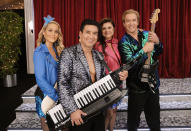 This image released by Peacock shows Elizabeth Berkley as Jessica Spano, Mario Lopez as A.C. Slater, Tiffani Thiessen as Kelly Kapowski, and Mark-Paul Gosselaar as Zack Morris who appear in the reboot of "Saved By the Bell." Zack Morris is now the California governor who has a son at Bayside High, Jess is a guidance counselor and A.C. Slater is now the gym teacher at Bayside. (Trae Patton/Peacock via AP)