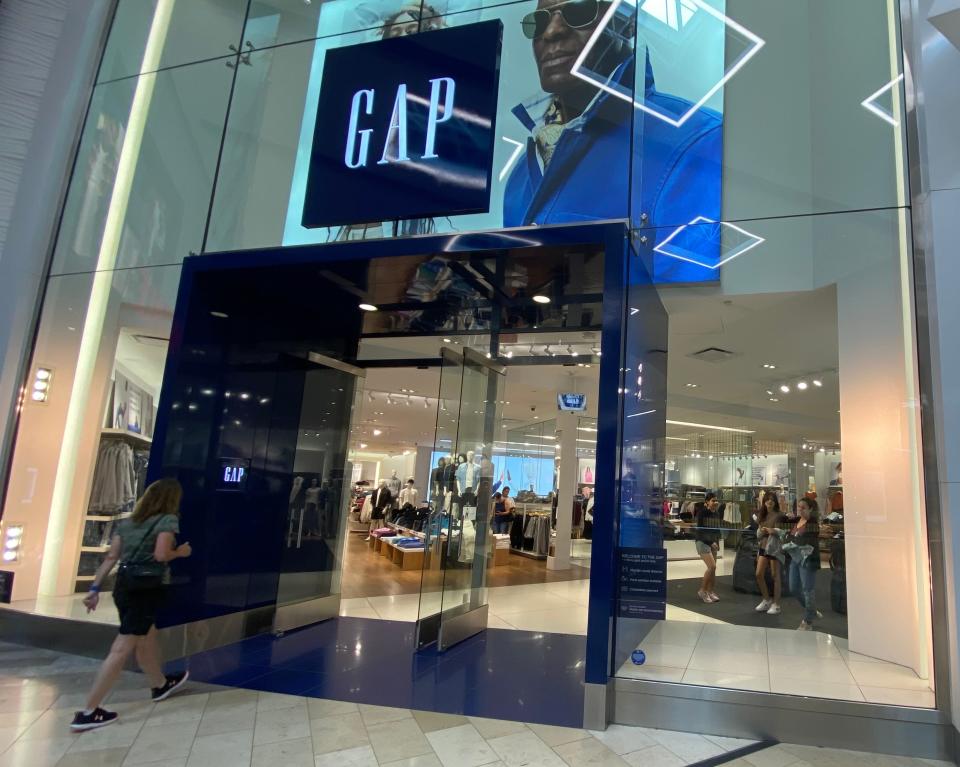 Shoppers leave and enter a Gap store in New Jersey on August 17, 2022.