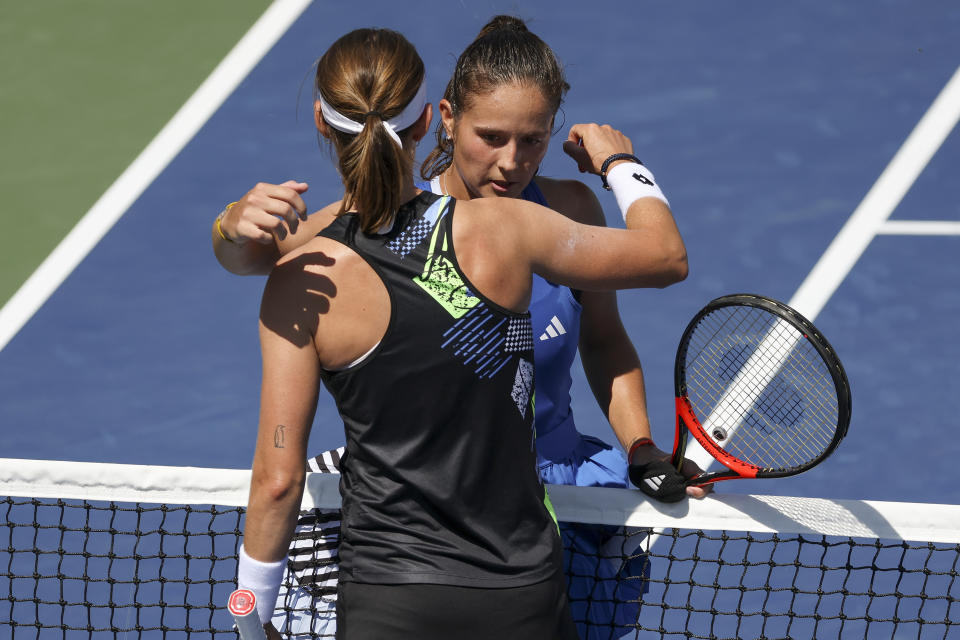 Daria Kasatkina, of Russia, hugs Greet Minnen, of Belgium, after defeating Minnen during the third round of the U.S. Open tennis championships, Saturday, Sept. 2, 2023, in New York. (AP Photo/Andres Kudacki)