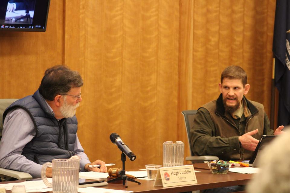 Boyne City Mayor Hugh Conklin (left) and Mayor Pro-tem Tim Nemecek debate the merits of a meeting regarding the city manager's position on Oct. 10.