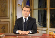 French President Emmanuel Macron speaks during a special address to the nation, his first public comments after four weeks of nationwide 'yellow vest' (gilet jaune) protests, at the Elysee Palace, in Paris, France December 10, 2018. Ludovic Marin/Pool via REUTERS