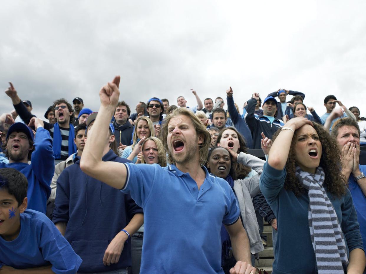 <span class="caption">Some conservatives view media as biased and take it personally.</span> <span class="attribution"><a class="link " href="https://www.gettyimages.com/detail/photo/stadium-crowd-jeering-open-mouthed-and-pointing-low-royalty-free-image/200244723-011" rel="nofollow noopener" target="_blank" data-ylk="slk:John Rowley/The Image Bank via Getty Images;elm:context_link;itc:0;sec:content-canvas">John Rowley/The Image Bank via Getty Images</a></span>