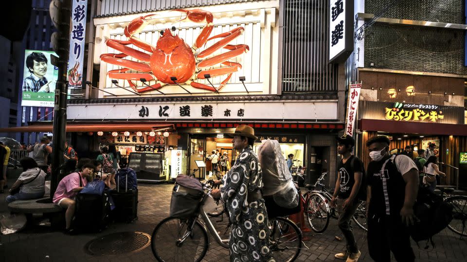 Dotonbori is famed for its neon illuminated signs. - Metin Aktas/Anadolu/Getty Images