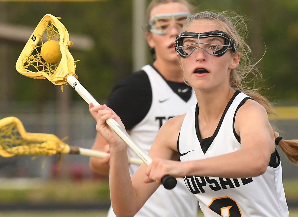 Topsail lacrosse's Martha Smith heads toward the goal during the Pirates' third-round win over Apex Friendship last week. KEN BLEVINS/STARNEWS