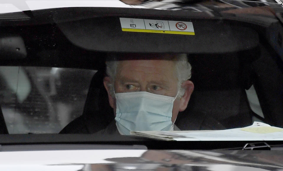 Britain's Prince Charles leaves the King Edward VII's hospital by car in London, Saturday Feb.20, 2021, following a visit to see his father Prince Philip. Buckingham Palace said the husband of Queen Elizabeth II, 99-year-old Prince Philip was admitted to the private King Edward VII Hospital on Tuesday evening after feeling unwell.(AP Photo/Alberto Pezzali)