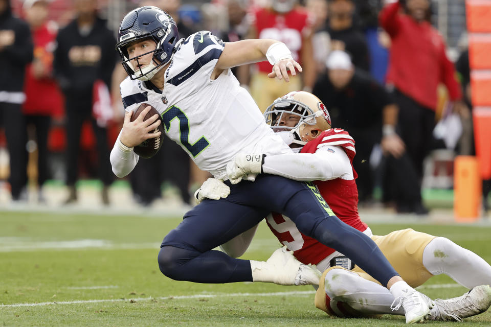 FILE - Seattle Seahawks quarterback Drew Lock (2) is sacked by San Francisco 49ers defensive end Clelin Ferrell during the second half of an NFL football game in Santa Clara, Calif., Sunday, Dec. 10, 2023. The intensity of NFL fandom that increased with the surge of fantasy football has spiked further in the age of online betting. “I was like, ‘Holy cow, this is a roller coaster of, ’You’re the best and you’re the worst,'" Lock said. (AP Photo/Josie Lepe, File)