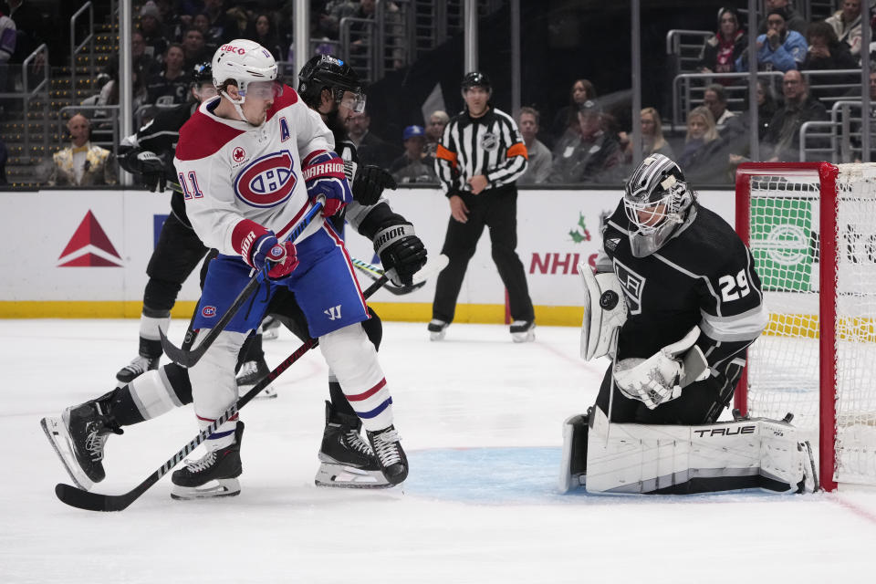 Los Angeles Kings goaltender Pheonix Copley (29) stops a shot in front of Montreal Canadiens right wing Brendan Gallagher (11) during the third period of an NHL hockey game, Saturday, Nov. 25, 2023, in Los Angeles. (AP Photo/Marcio Jose Sanchez)