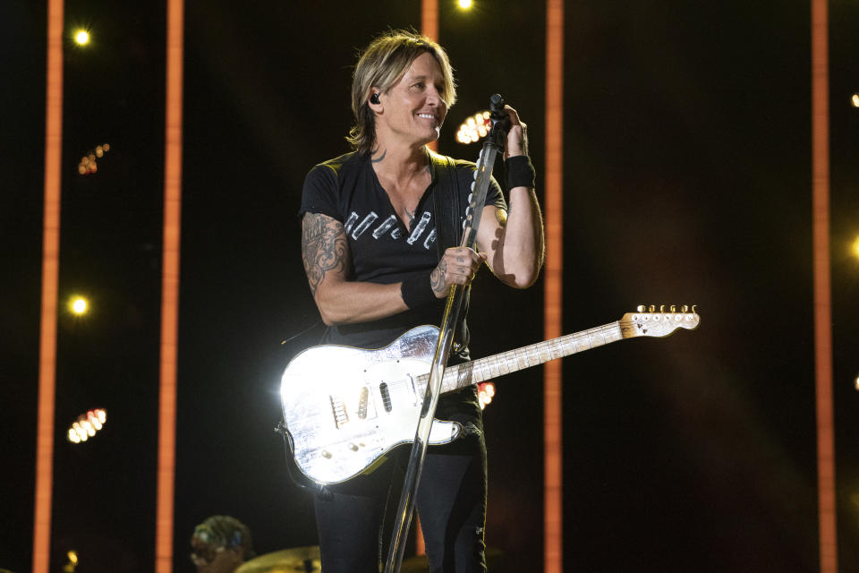 FILE - Keith Urban performs during the 2023 CMA Fest on Friday, June 9, 2023, at Nissan Stadium in Nashville, Tenn. Urban and Kix Brooks of powerhouse duo Brooks & Dunn will be inducted into the Nashville Songwriters Hall of Fame at the 53rd anniversary gala held at Nashville’s Music City Center. (Photo by Amy Harris/Invision/AP, File)