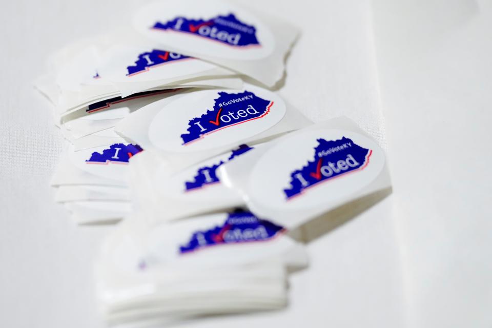 Voting stickers are laid out for early voters at the Northern Kentucky Convention Center in Covington, Ky., on Thursday, Nov. 3, 2022.