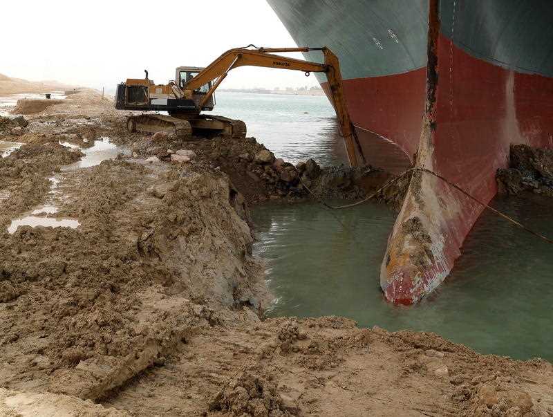 A handout photo made available by the Suez Canal Authority, shows the Ever Given container ship which ran aground in the Suez Canal, Egypt.