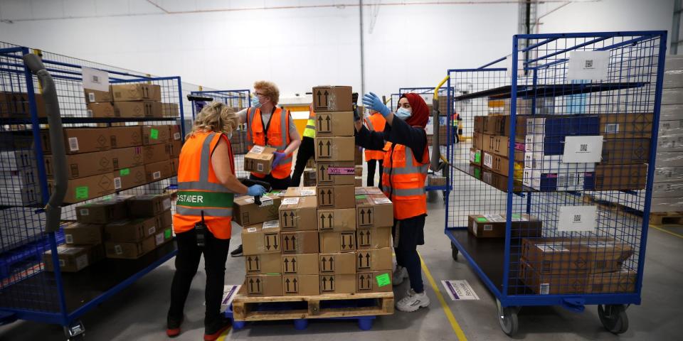 Amazon warehouse workers handling COVID tests