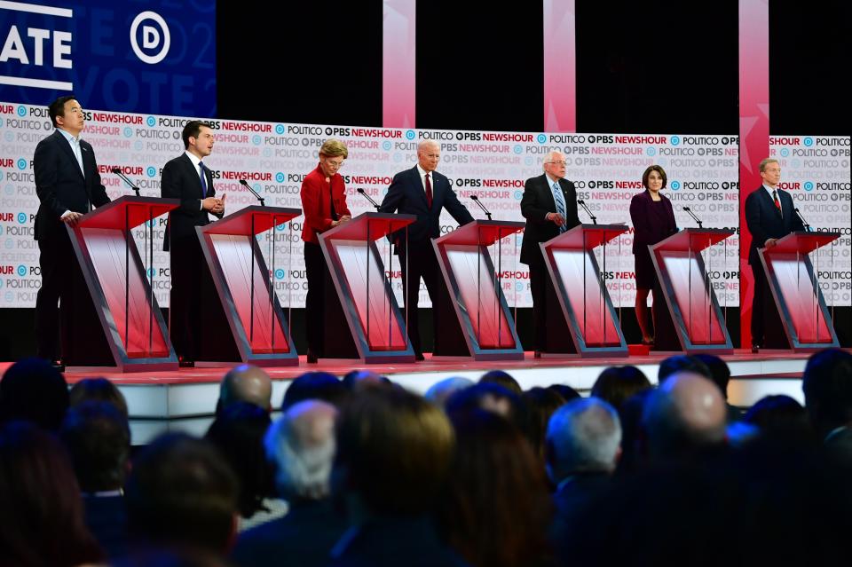 (From L) Democratic presidential hopefuls, entrepreneur Andrew Yang, Mayor of South Bend, Indiana Pete Buttigieg, Massachusetts Senator Elizabeth Warren, former Vice President Joe Biden, Vermont Senator Bernie Sanders, Minnesota Senator Amy Klobuchar and businessman Tom Steyer participate of the sixth Democratic primary debate of the 2020 presidential campaign season co-hosted by PBS NewsHour & Politico at Loyola Marymount University in Los Angeles, California on December 19, 2019. (Photo by Frederic J. Brown / AFP) (Photo by FREDERIC J. BROWN/AFP via Getty Images)