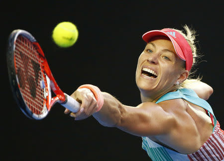 Germany's Angelique Kerber stretches for a shot tduring her final match against Serena Williams of the U.S. at the Australian Open tennis tournament at Melbourne Park, Australia, January 30, 2016. REUTERS/Thomas Peter