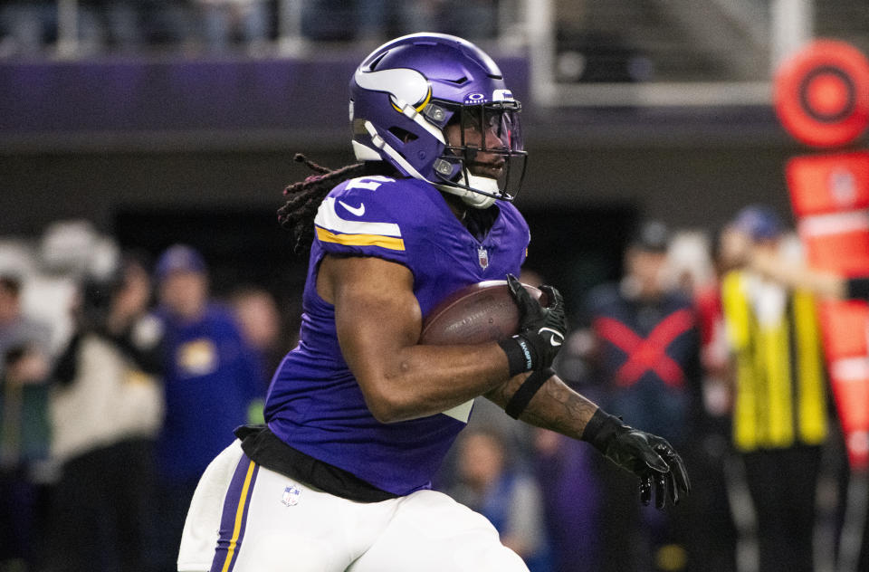 MINNEAPOLIS, MINNESOTA - DECEMBER 31: Alexander Mattison #2 of the Minnesota Vikings carries the ball in the third quarter of the game against the Green Bay Packers at U.S. Bank Stadium on December 31, 2023 in Minneapolis, Minnesota. (Photo by Stephen Maturen/Getty Images)