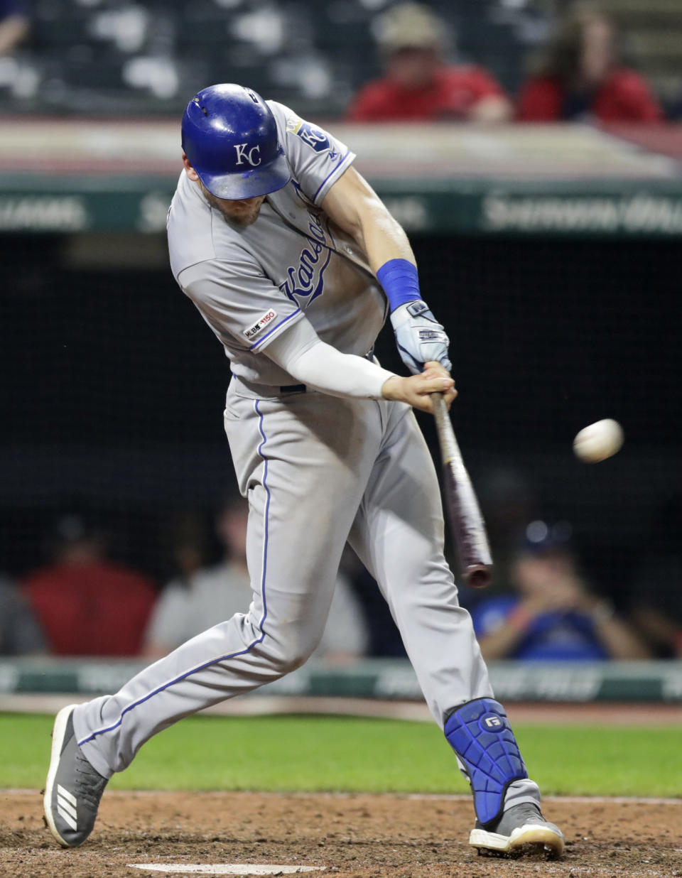 Kansas City Royals' Hunter Dozier hits a grand slam in the ninth inning of a baseball game against the Cleveland Indians, Tuesday, June 25, 2019, in Cleveland. Whit Merrifield, Nicky Lopez and Alex Gordon scored on the play. (AP Photo/Tony Dejak)