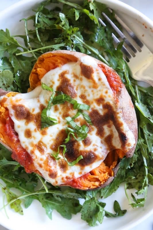 <p>Skinnytaste</p><p>Savory stuffed sweet potatoes topped with Italian flavors such as marinara sauce and mozzarella cheese. A quick & easy sweet potato recipe that’s a healthy vegetarian dish. Get the recipe for <strong><a href="https://www.skinnytaste.com/stuffed-sweet-potatoes-italian-style/" rel="nofollow noopener" target="_blank" data-ylk="slk:Italian-Style Stuffed Sweet Potatoes;elm:context_link;itc:0;sec:content-canvas" class="link rapid-noclick-resp">Italian-Style Stuffed Sweet Potatoes</a>.</strong></p>