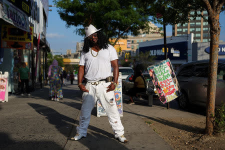 Robert Norman, 37, a street vendor and musician, poses for a picture in the Bronx borough of New York, U.S., September 2, 2018. Norman said he's a very unique person and emphasised the importance of creativity in his style. REUTERS/Caitlin Ochs