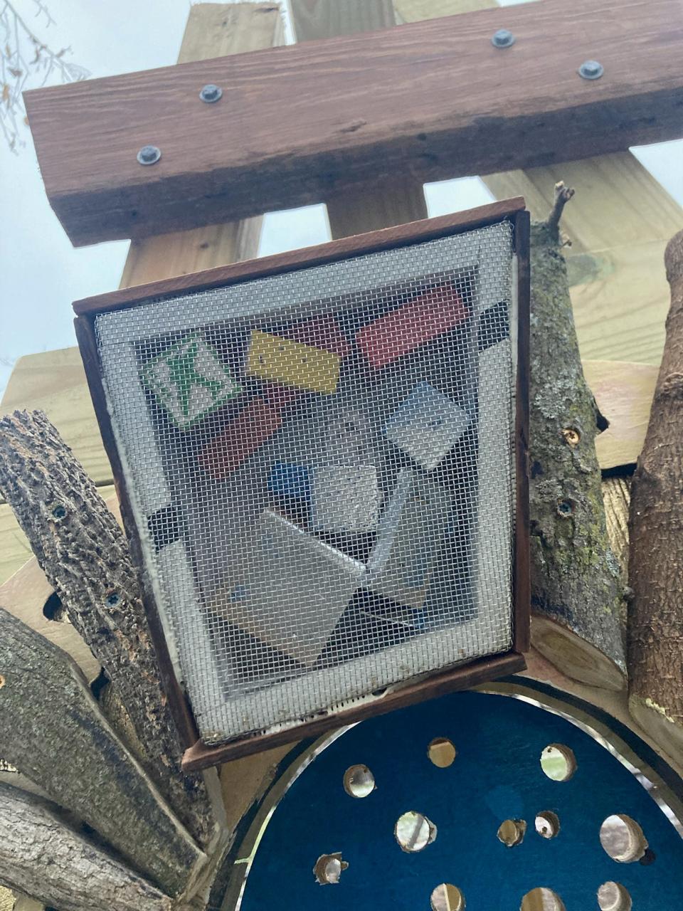 Wire mesh-covered shadowboxes feature elements related to where Henry Dean's sculptures are placed for his installation 'Now and Then'