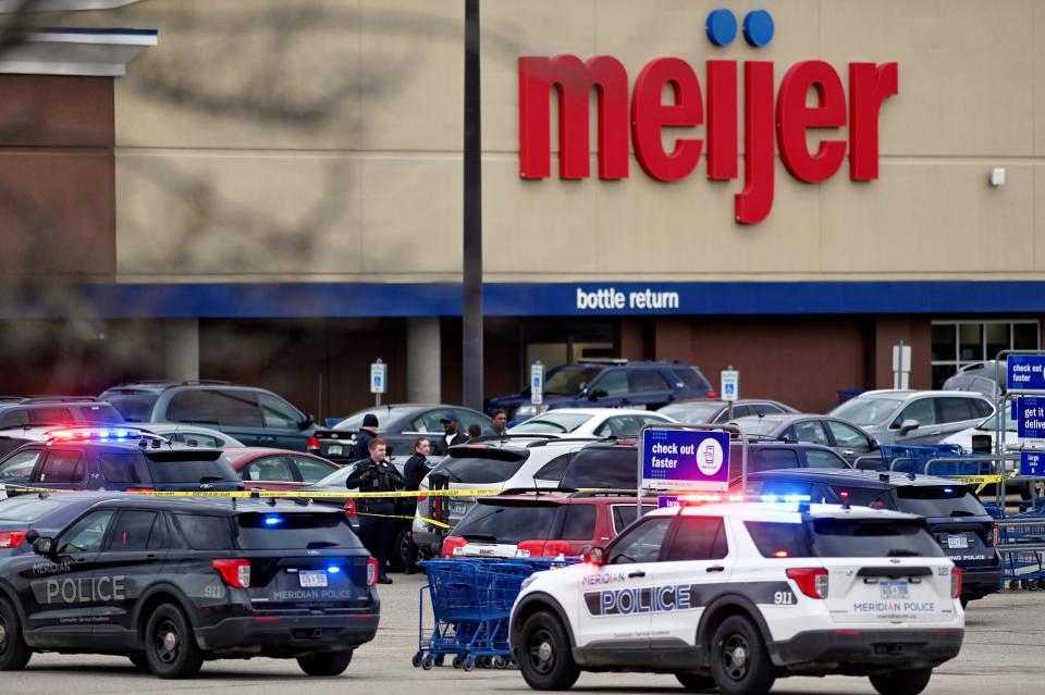 Police from multiple agencies work the scene of a shooting outside the Meijer location on Lake Lansing Road in East Lansing on Monday, April 25, 2022.