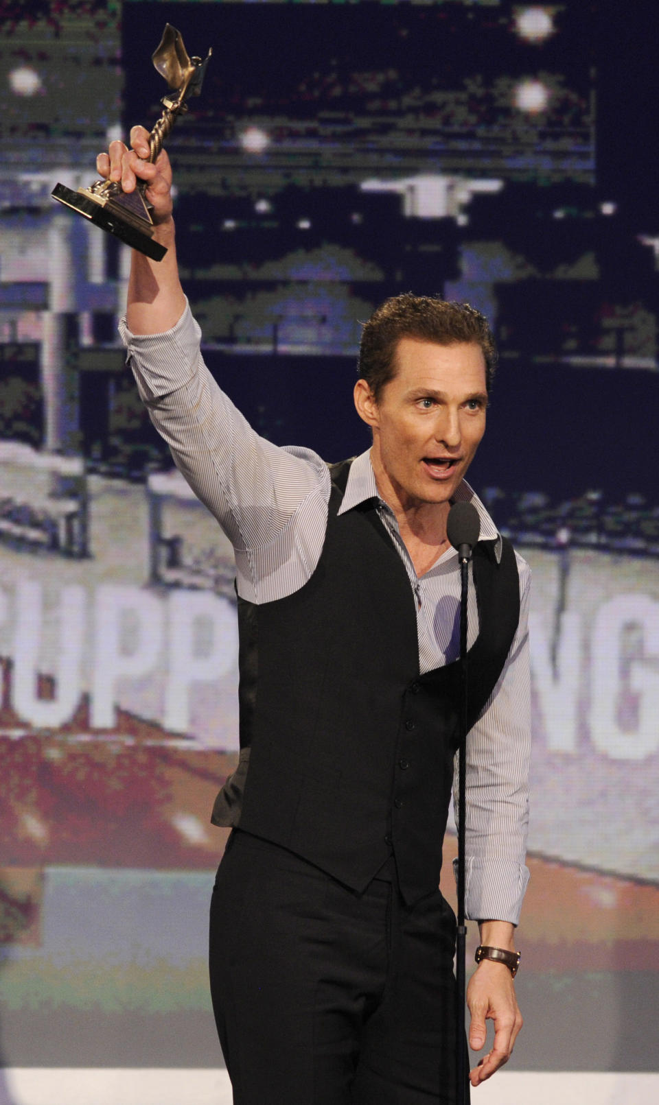 Actor Matthew McConaughey accepts the award for best supporting male for "Magic Mike," at the Independent Spirit Awards on Saturday, Feb. 23, 2013, in Santa Monica, Calif. (Photo by Chris Pizzello/Invision/AP)