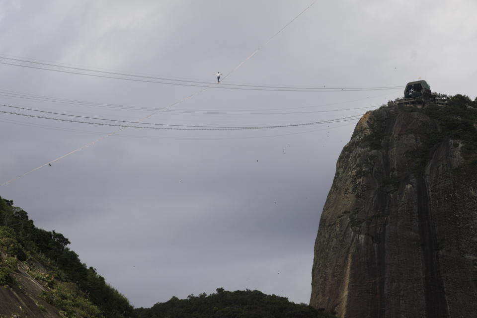 French acrobat Nathan Paulin walks on a slackline between Babilonia Hill and Urca Hill near Pao de Acucar Mountain (Sugarloaf Mountain) in Rio de Janeiro, Brazil, December 4, 2021. REUTERS/Ricardo Moraes