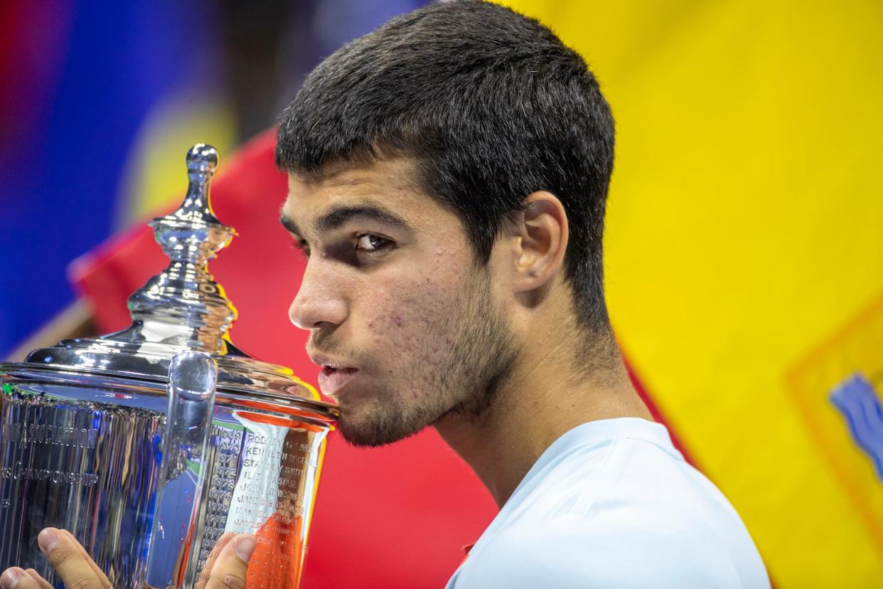 Carlos Alcaraz of Spain with the winner's trophy after his victory against Casper Rudd of Norway in the Men's Singles Final match on Arthur Ashe Stadium with the roof closed during the US Open Tennis Championship 2022 at the USTA National Tennis Centre.
