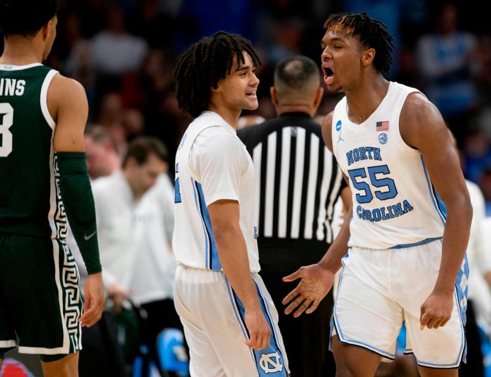 North Carolina’s Harrison Ingram (55) celebrates with Elliot Cadeau (2) after sinking a basket to take a 12 point lead against Michigan State on Saturday, March 23, 2024, during the second round of the NCAA Tournament at Spectrum Center in Charlotte, N.C. Ingram scored 17 points in the victory.