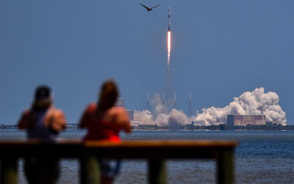 Campers at KARS Park on Merritt Island watch the launch of a SpaceX Falcon 9 rocket at Camp Canaveral - Malcolm Denemark /Florida Today 