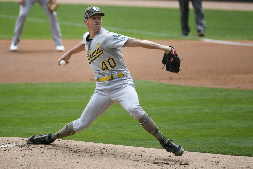 Oakland Athletics pitcher Chris Bassitt throws against the Minnesota Twins during the first inning of a baseball game, Sunday, May 16, 2021, in Minneapolis. (AP Photo/Craig Lassig)