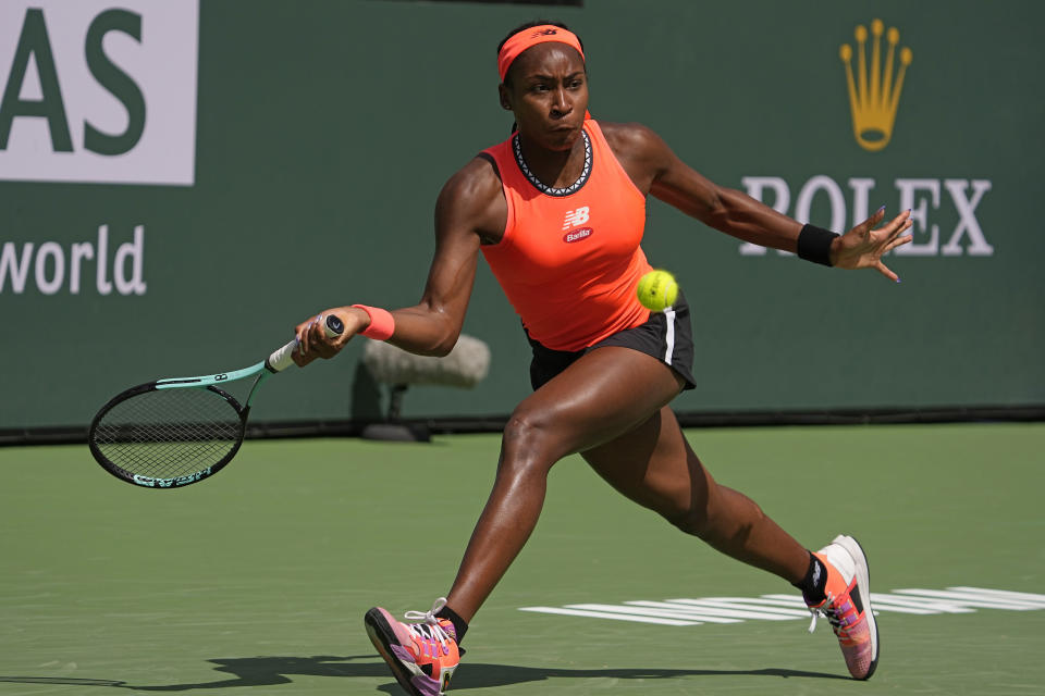 Coco Gauff, of the United States, returns a shot to Aryna Sabalenka, of Belarus, at the BNP Paribas Open tennis tournament Wednesday, March 15, 2023, in Indian Wells, Calif. (AP Photo/Mark J. Terrill)