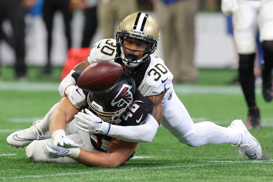 ATLANTA, GEORGIA – SEPTEMBER 11: Safety Justin Evans #30 of the New Orleans Saints knocks a pass away from tight end <a class="link " href="https://sports.yahoo.com/nfl/players/32588" data-i13n="sec:content-canvas;subsec:anchor_text;elm:context_link" data-ylk="slk:Parker Hesse;sec:content-canvas;subsec:anchor_text;elm:context_link;itc:0">Parker Hesse</a> #46 of the Atlanta Falcons during the second half at Mercedes-Benz Stadium on September 11, 2022 in Atlanta, Georgia. (Photo by Kevin C. Cox/Getty Images)