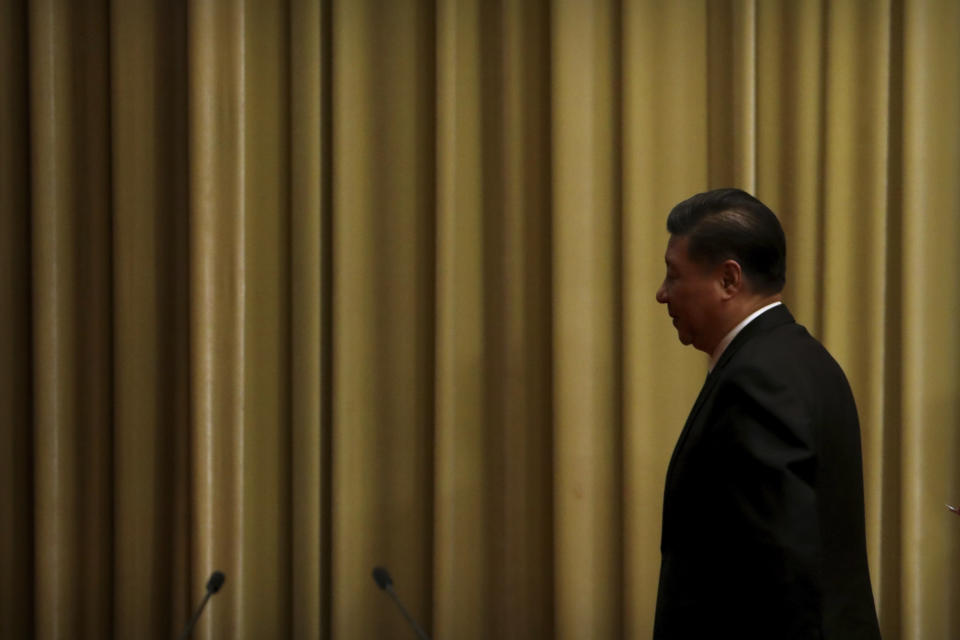 Chinese President Xi Jinping leaves following an event to commemorate the 40th anniversary of the Message to Compatriots in Taiwan at the Great Hall of the People in Beijing, Wednesday, Jan. 2, 2019. Xi urged both sides to reach an early consensus on the unification of China and Taiwan and not leave the issue for future generations. (AP Photo/Mark Schiefelbein, Pool)