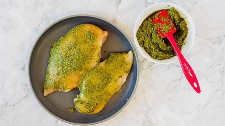 raw chicken with pesto