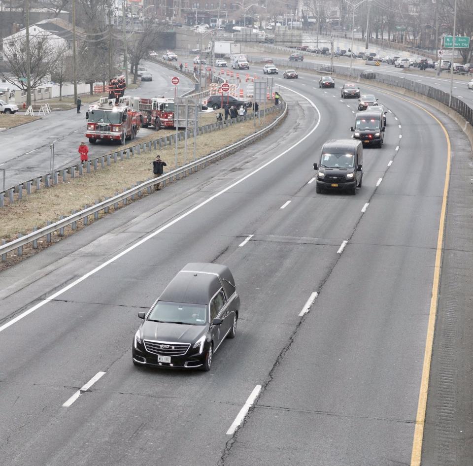 The hearse carrying New York City police officer Jason Rivera passes through Yonkers after his funeral mass in Manhattan on Jan. 28, 2022. He was then buried in Hartsdale.