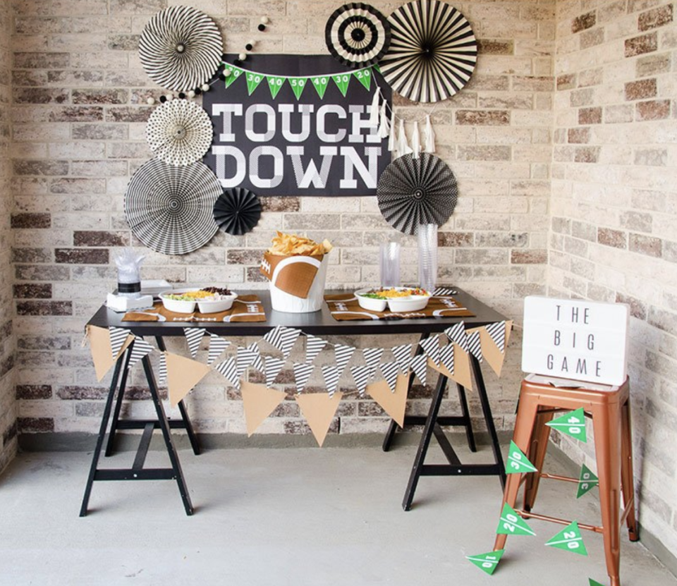 <p>Adding a festive "touchdown" backdrop to your food spread will encourage guests to keep snacking throughout the game. </p><p><a href="https://love-the-day.com/football-game-food" rel="nofollow noopener" target="_blank" data-ylk="slk:Get the tutorial at Love the Day »;elm:context_link;itc:0" class="link "><em>Get the tutorial at Love the Day »</em></a></p>