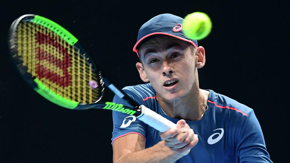 Australia’s Alex De Minaur returns to Greece’s Stefanos Tsitsipas during the men’s final of the Next Generation ATP Finals in Milan on November 10, 2018. (Photo by Miguel MEDINA / AFP)