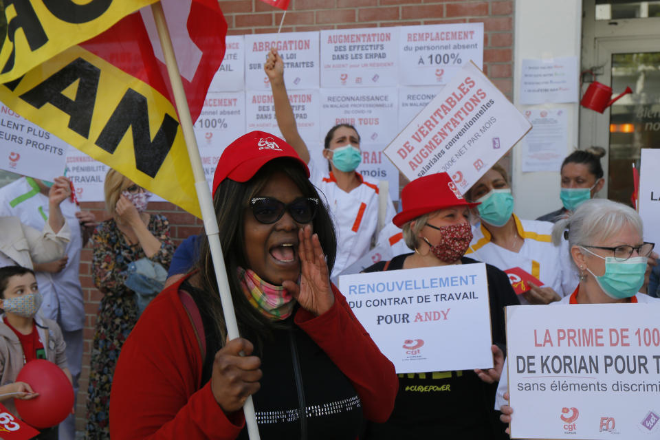 Employees demonstrate to demand higher wages outside a nursing home of the Korian group, one of the market leaders in the lucrative industry of providing care and assisted living facilities for older adults, Monday, May 25, 2020 in Lille, northern France. In France, the group is facing several lawsuits filed by families who have lost loved ones during the coronavirus pandemic that has caused thousands of deaths in French care homes. (AP Photo/Michel Spingler)