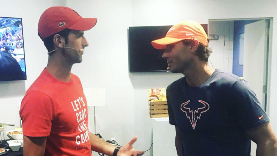 Rafael Nadal (pictured right) speaks to Novak Djokovic (pictured left) in the locker room.