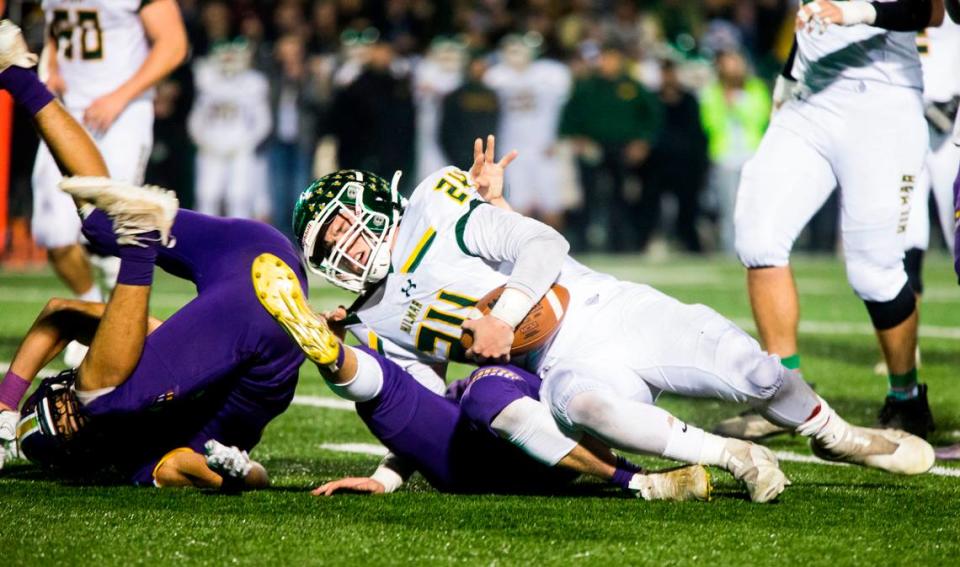 Jason Pimentel, 24, gets taken down by the defense from Escalon High. Escalon High School took on Hilmar High football during the 2021 CIF Sac-Joaquin Football Playoffs - Division V at Saint Mary’s High School in Stockton, Ca. Escalon came out on top as the champions with a 20-13 win over Hilmar.