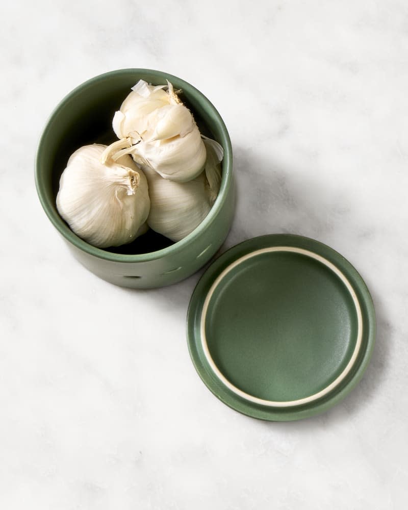 garlic in a ceramic storage container.