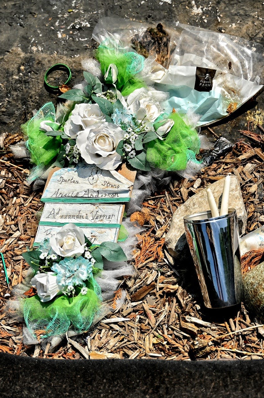 The remaining items in honor of those killed in the campus shooting rest at the base of The Rock on Thursday, July 27, 2023, on the Michigan State University campus in East Lansing.