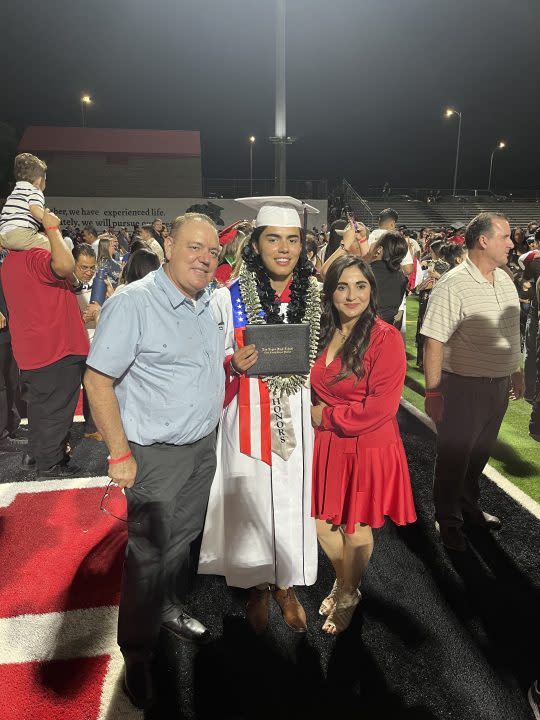 Julian Torres was photographed with his parents while graduating from Las Vegas High School in May. (Paulina Flores)