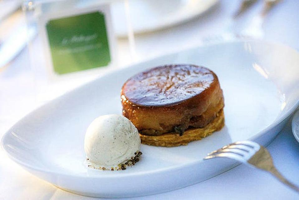 Le Bilboquet's tarte tatin (upside-down caramelized apple tart) is served with vanilla ice cream.